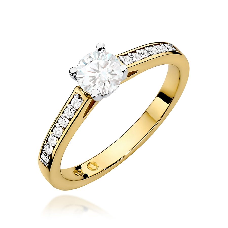 Pierścionek z brylantem 0,62 ct w żółtym złocie · W052