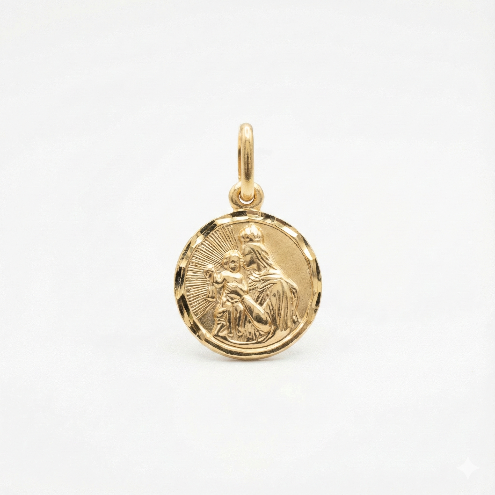 Złoty medalik z wizerunkiem Matki Boskiej i Dzieciątka Jezus.