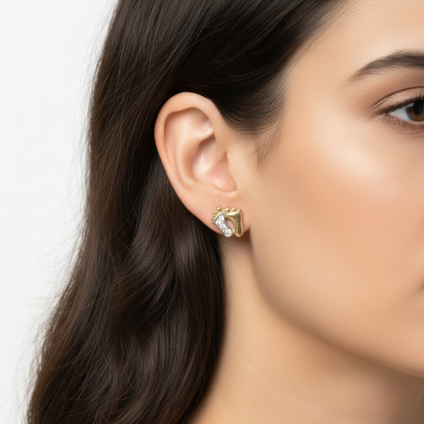 Model wearing gold earrings with zirconia.