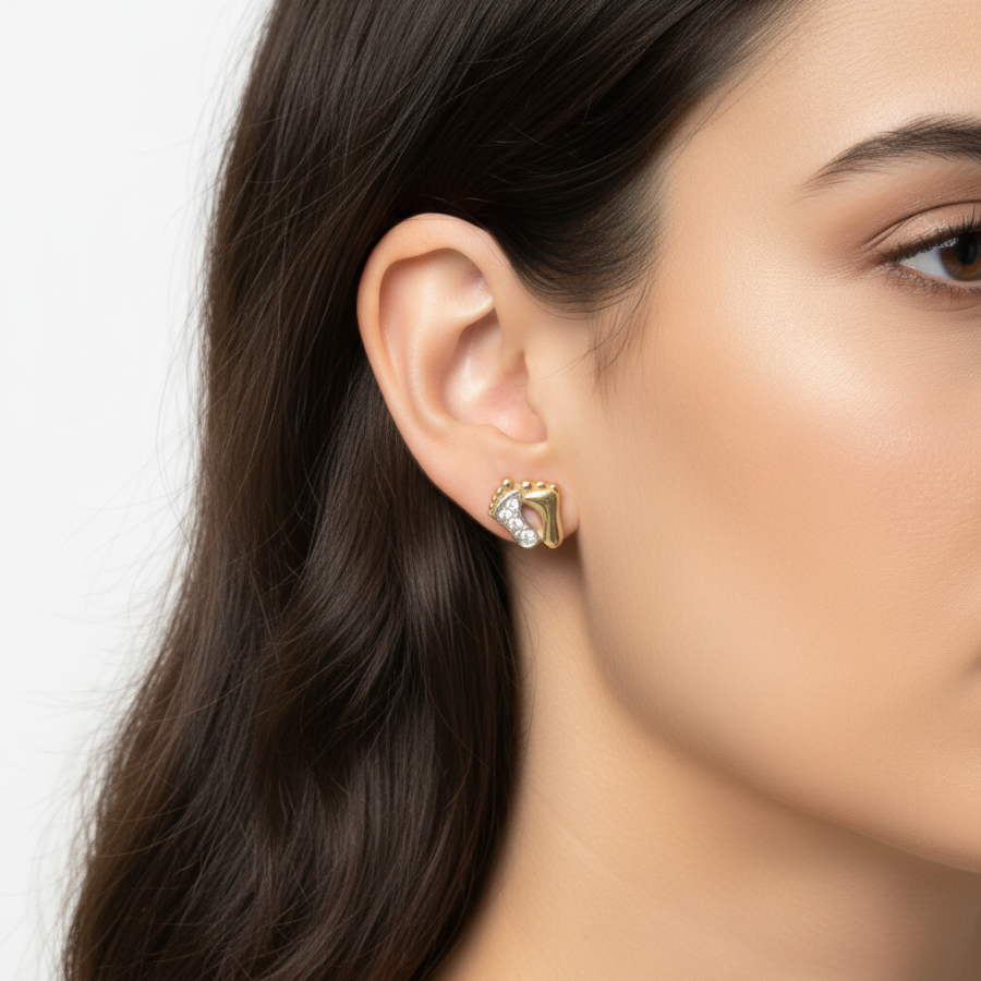 Model wearing gold earrings with zirconia.