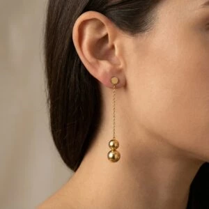 Złote wiszące kolczyki w kształcie kul