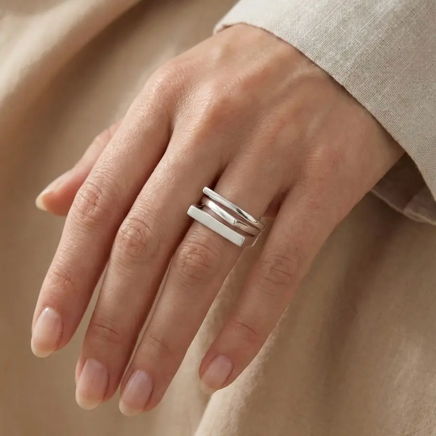 Minimalist silver ring with square shapes.